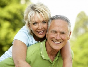 happy older man and woman feeling youthful