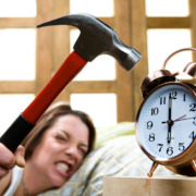 girl smashing alarm clock