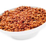 dry red lentils in white bowl